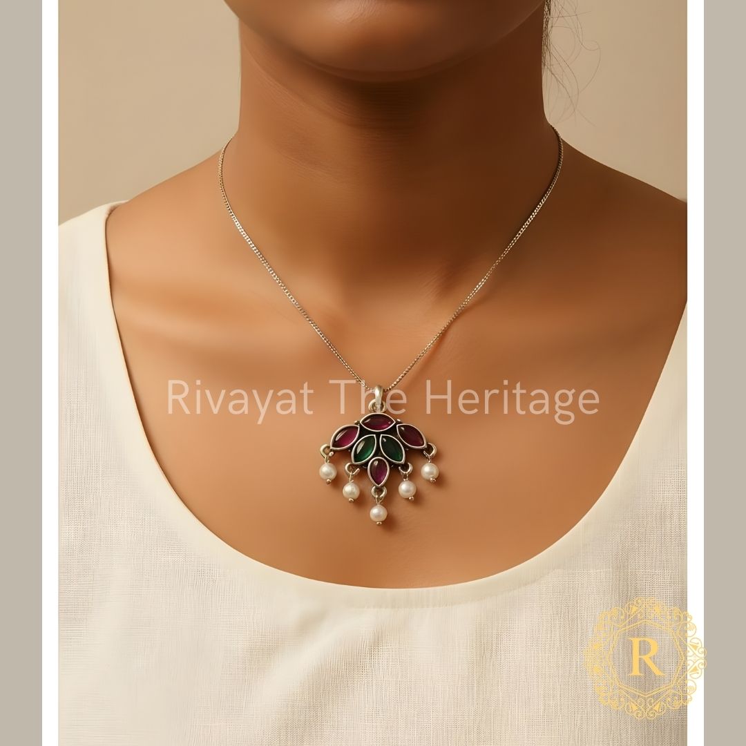Handcrafted oxidized German silver pendant with red and green Monalisa stones and pearl drops on model