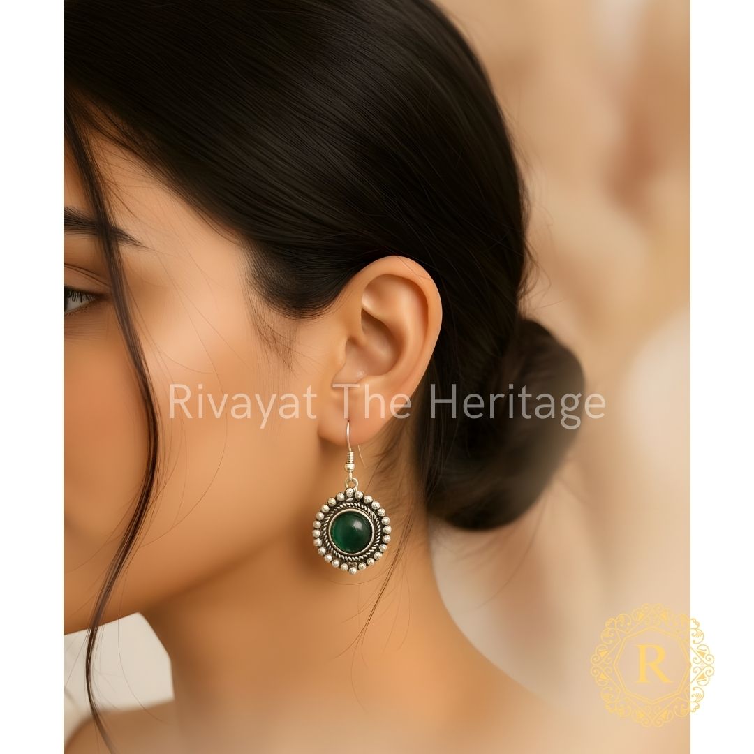 Handcrafted German silver oxidized earrings with green Monalisa stone by Rivayat The Heritage Manika collection