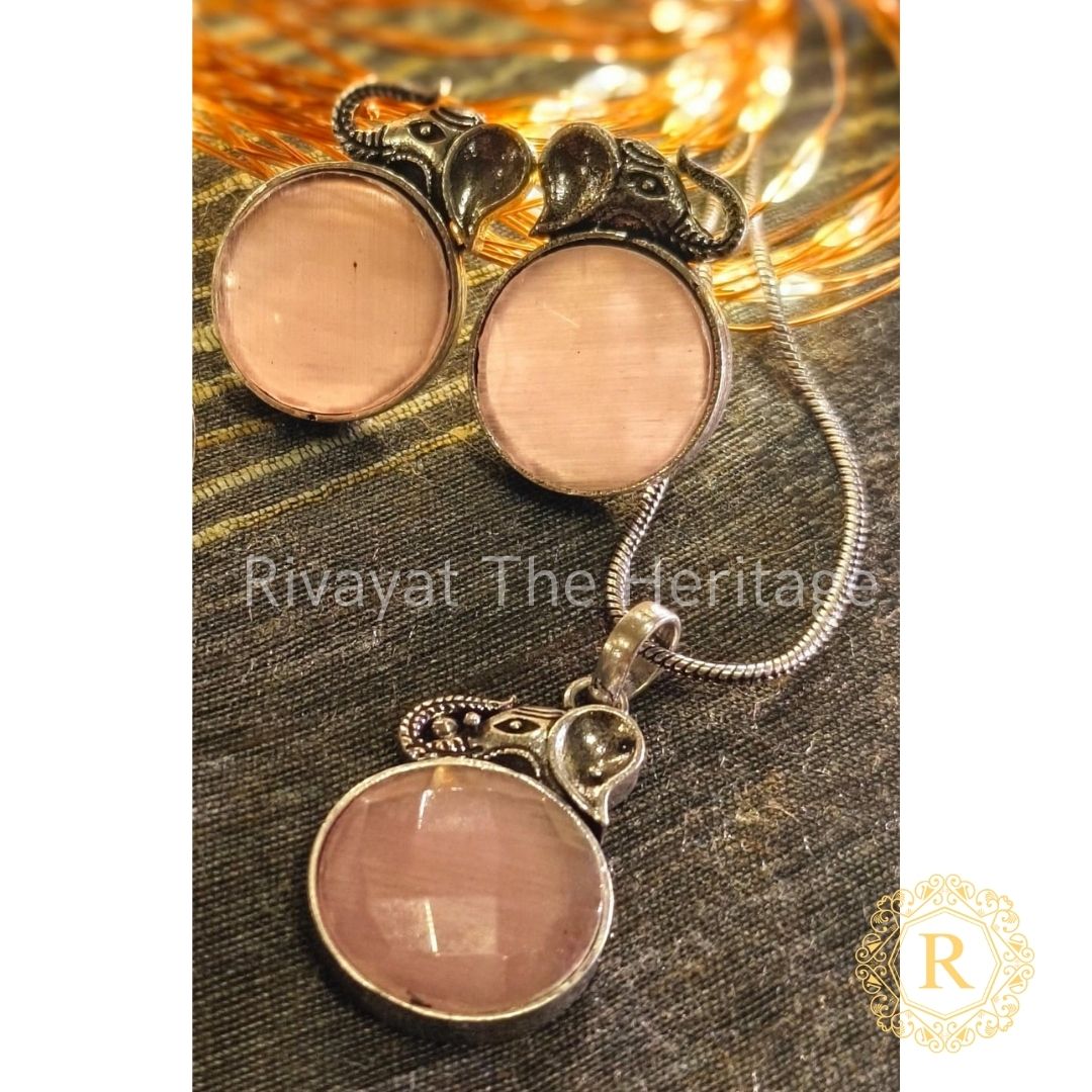 Rose quartz German silver oxidized jewelry set with intricate handcrafted earrings and pendant featuring Monalisa stones by Rivayat The Heritage