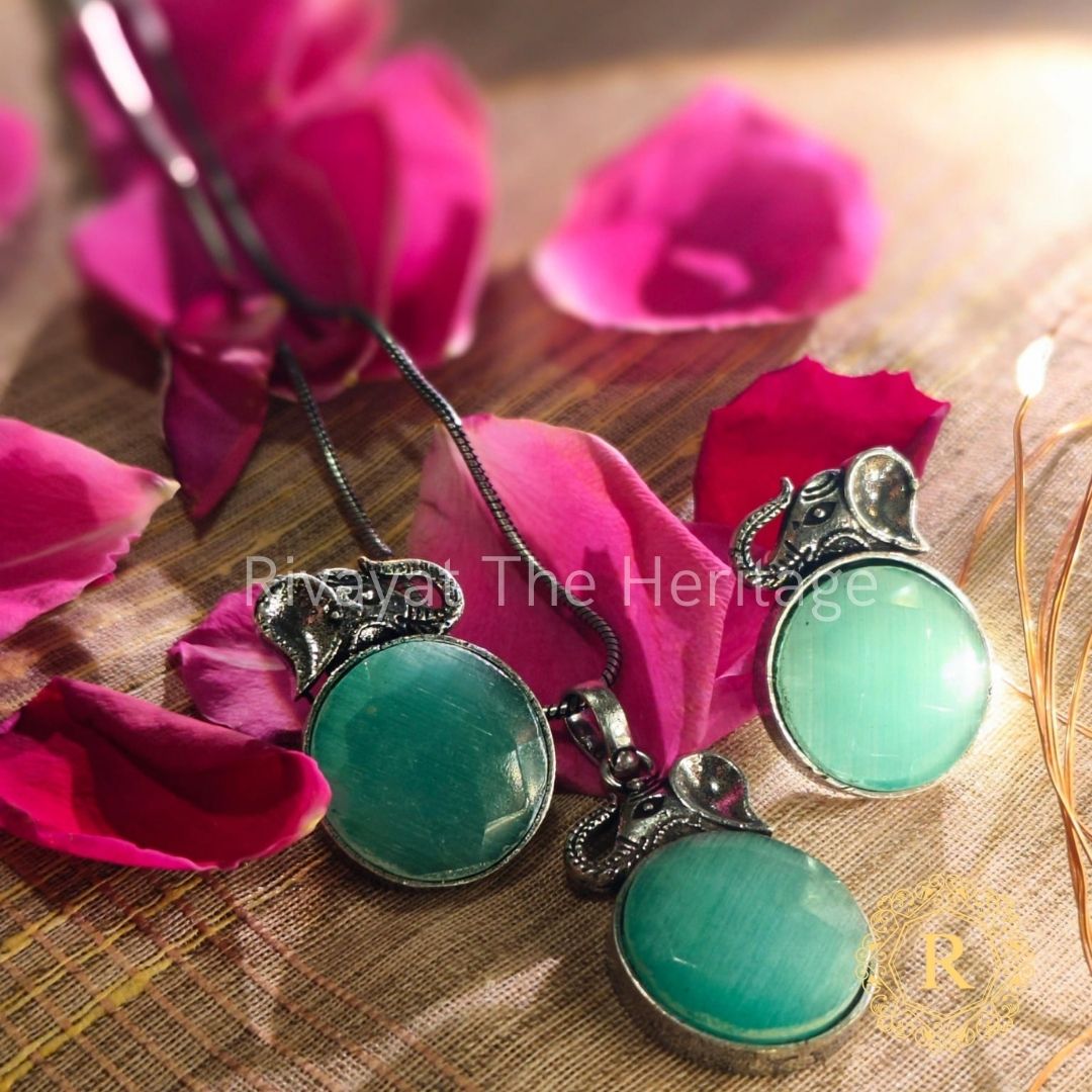 Manika Green Monalisa Stone Oxidized Silver Jewelry Set