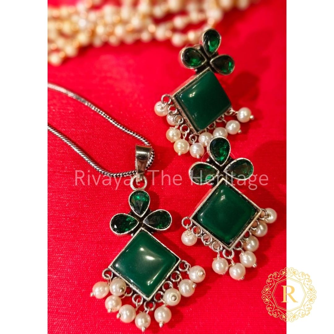 Handcrafted emerald green Monalisa stone oxidized German silver earrings and pendant set with pearls by Rivayat The Heritage