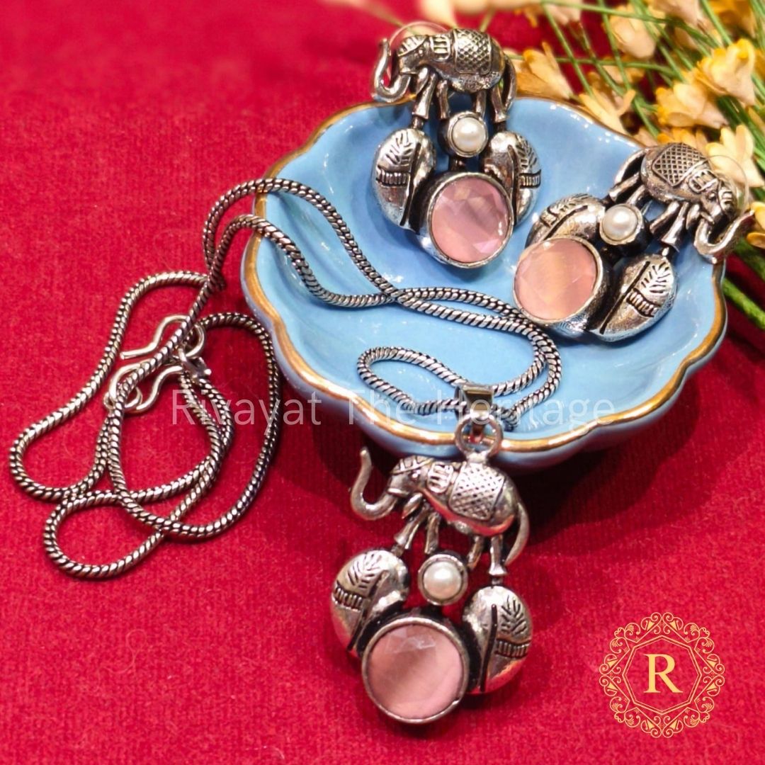 Handcrafted German silver elephant motif jewelry set with rose quartz stones and pearl accents by Rivayat Heritage Manika collection