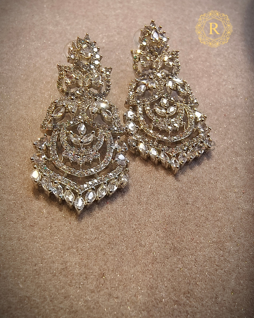 Close-up of handcrafted zircon diamond earrings from Manika Collection