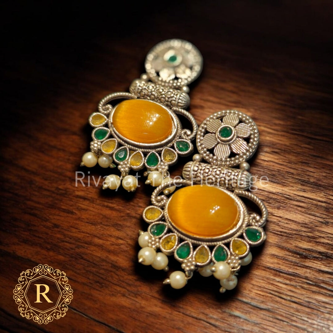 Kanakshree Handcrafted Earrings – Yellow Stone with Green Enamel & Oxidized Finish