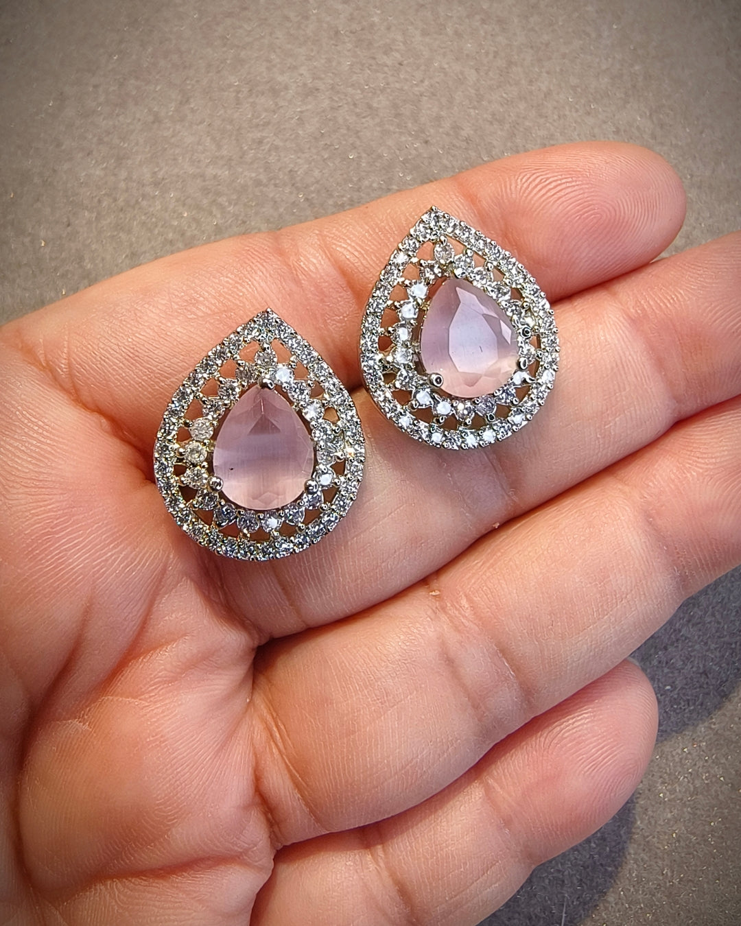 Pink stone zircon diamond earrings showing detailed teardrop setting