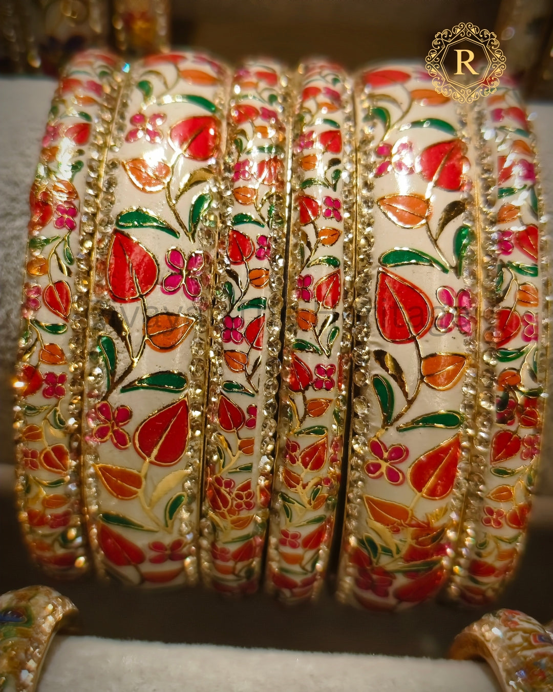 Traditional white Meenakari bangles with stone-studded border, artisan made