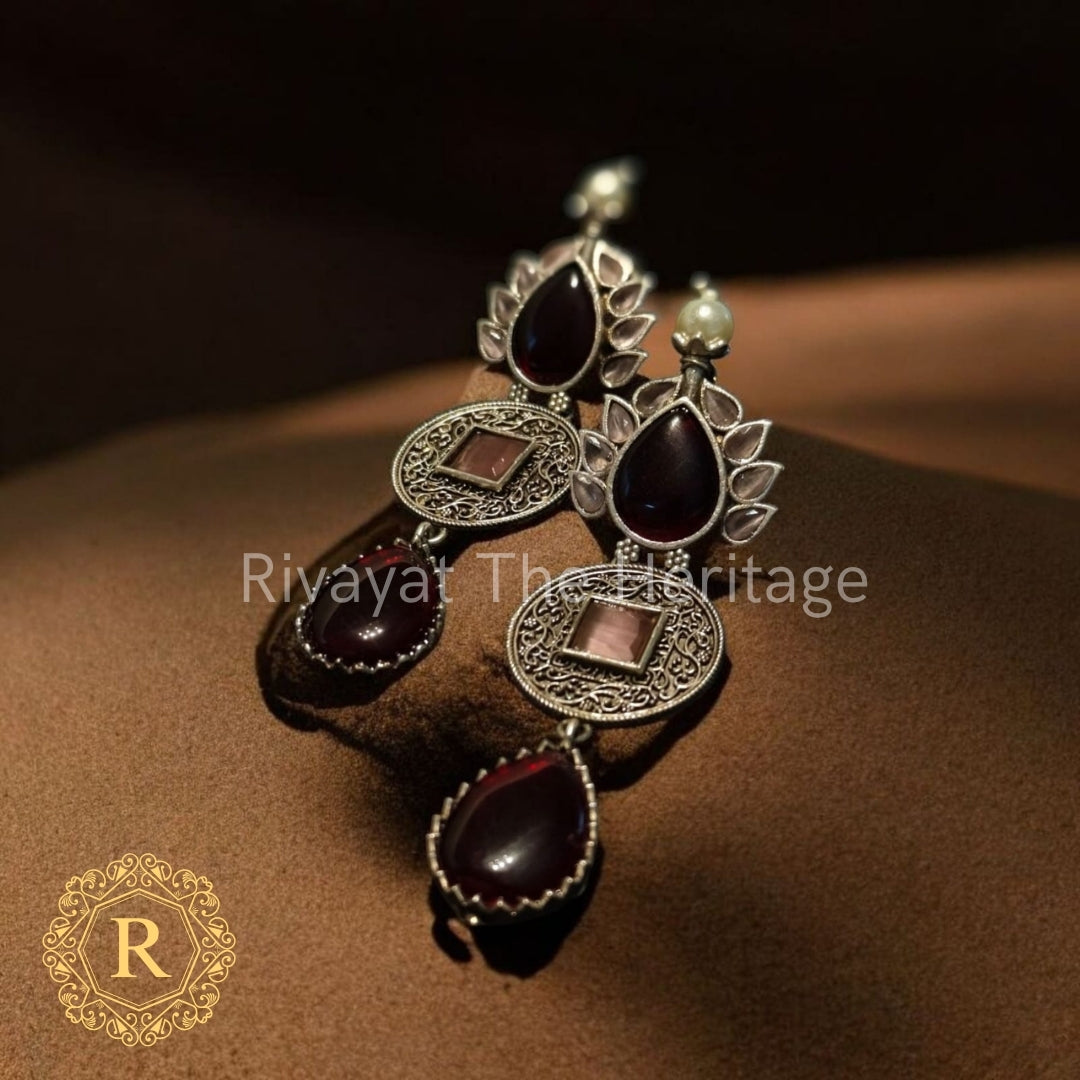 Raudra Keshari Statement Earrings – Oxidized Silver with Garnet-Red Stones & Vintage Motifs
