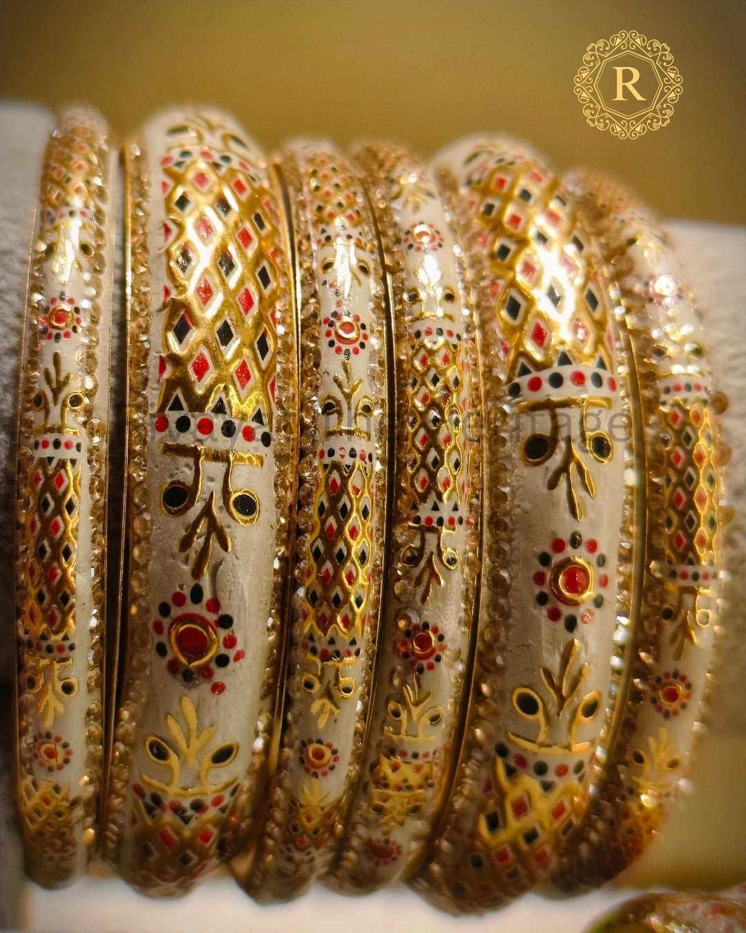 Ivory Meenakari bangles set with peacock and floral gold enamel work
