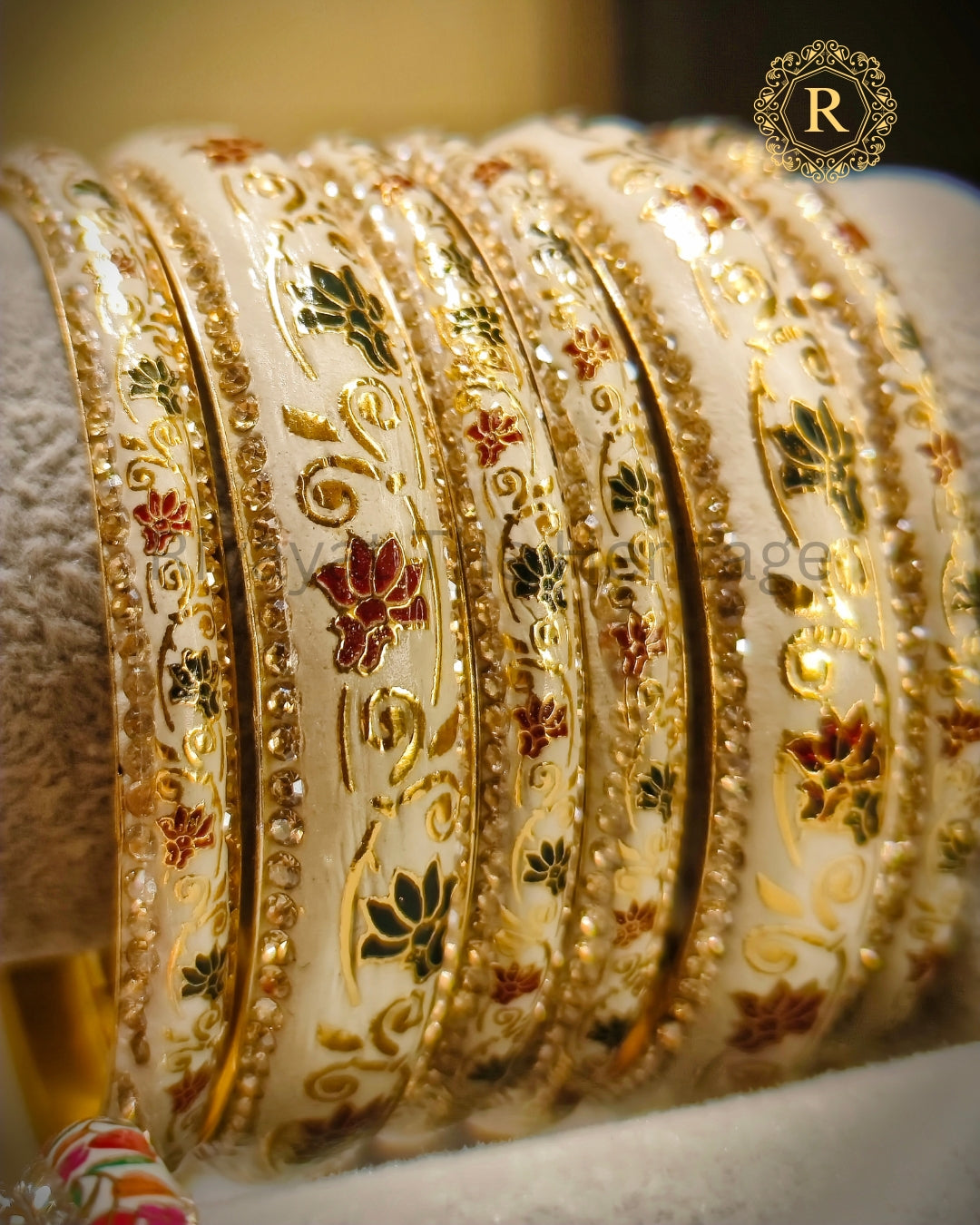 Ivory meenakari bangles with red and green lotus enamel work and stone border