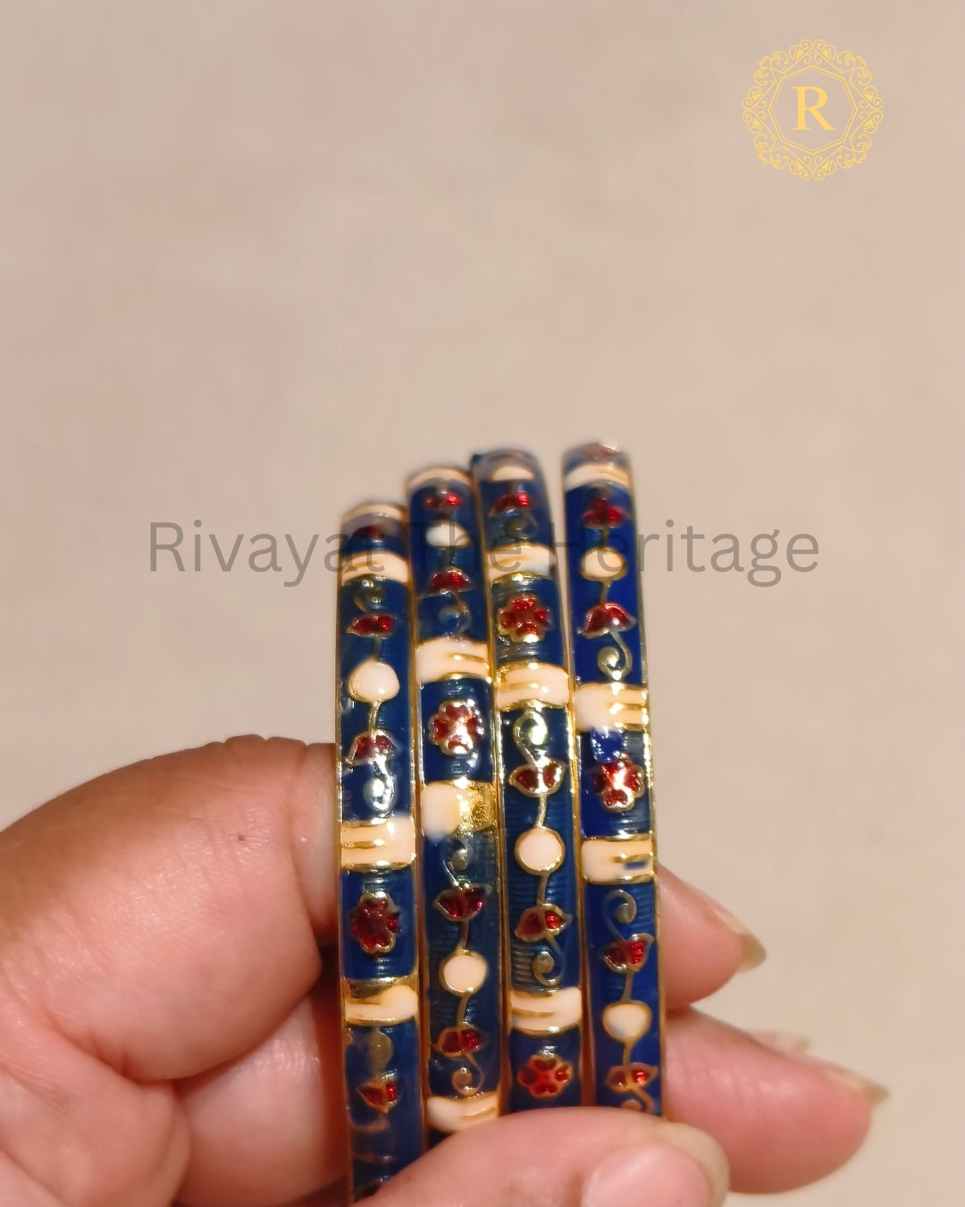 Close-up of blue Meenakari bangles showing gold detailing and enamel craftsmanship, Rivayat The Heritage