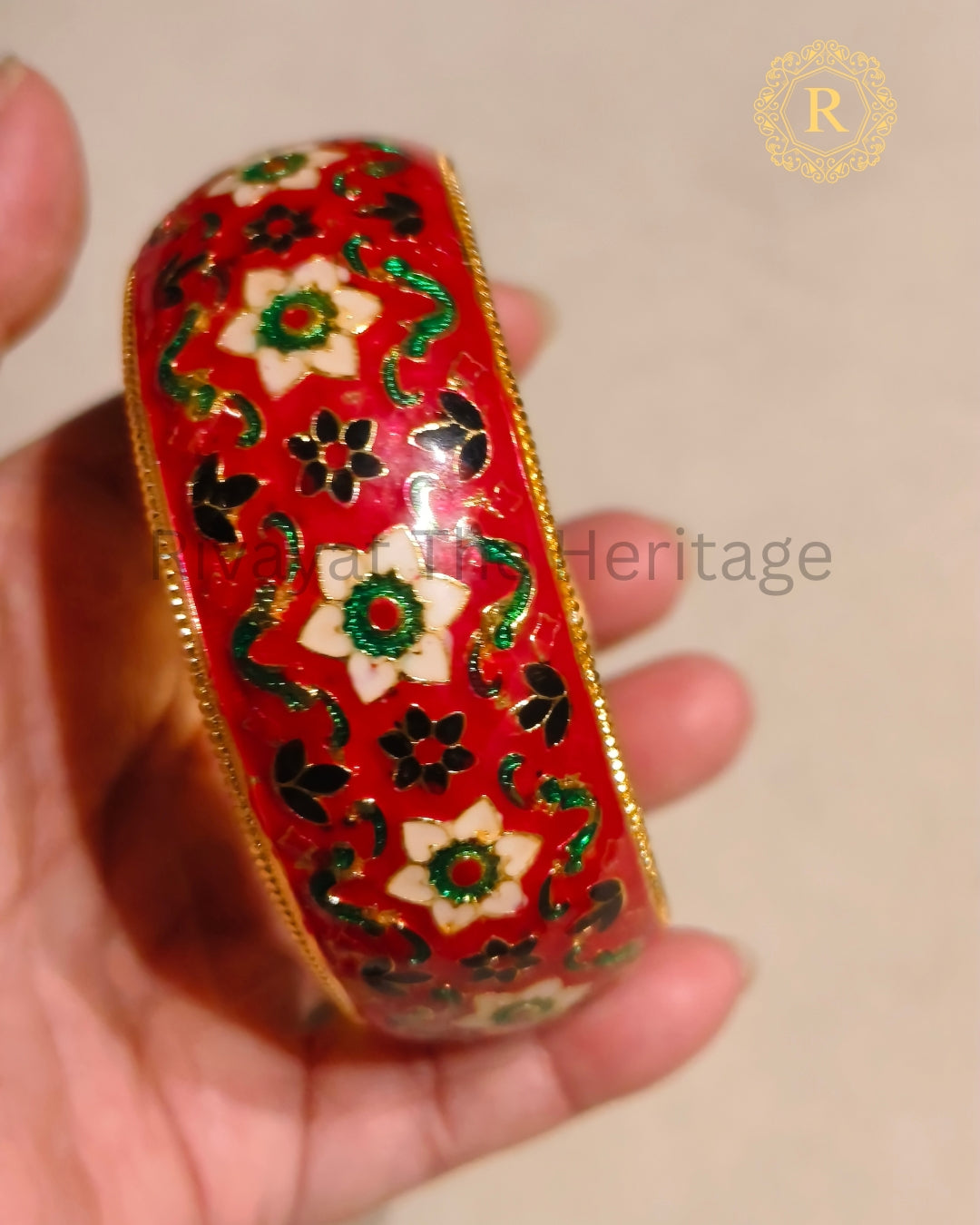 Traditional red Meenakari Kada showing colourful floral and leaf motifs