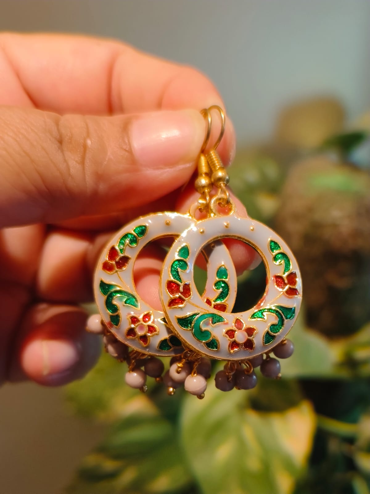 Handmade Meenakari hoop earrings with white enamel, red and green floral motifs, gold outlines and pink bead drops – Rivayat The Heritage