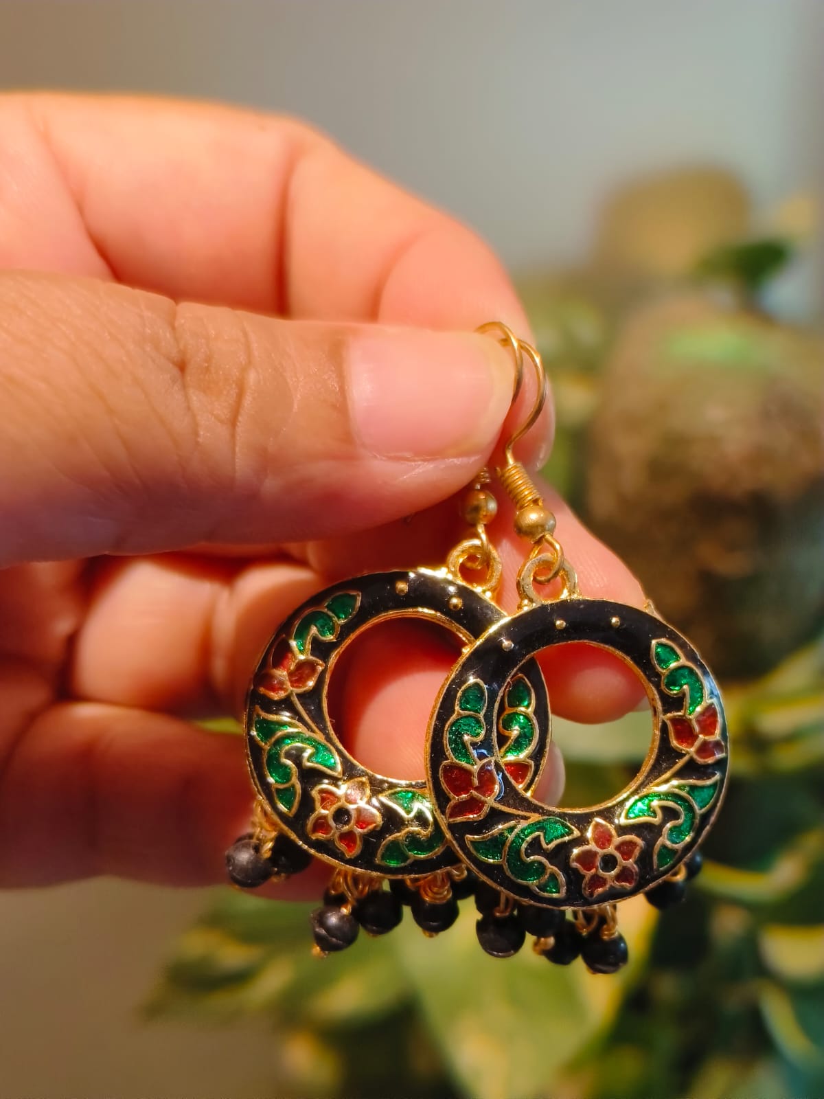 Pair of handcrafted black Meenakari hoop earrings with gold enamel floral work — Rivayat Heritage