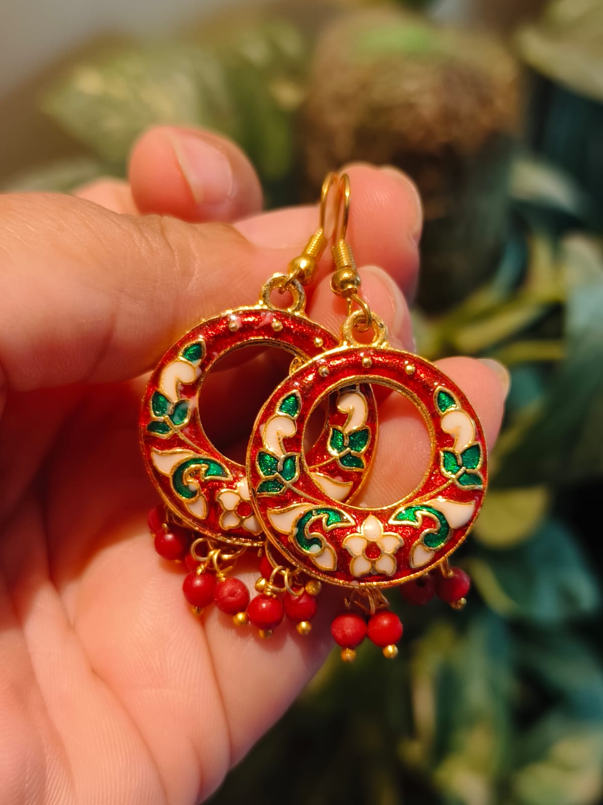 Pair of handmade red Meenakari chandbali earrings with ivory floral motifs and dangling coral beads — Rivayat Heritage