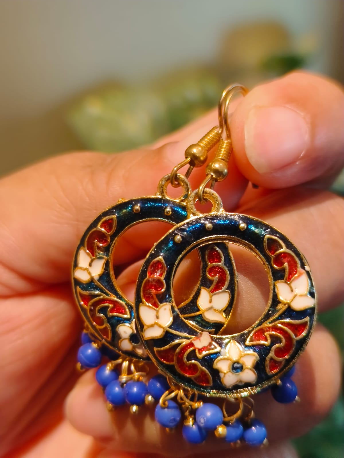 Meenakari hoop earring in navy blue enamel with red and white floral motifs and hanging blue beads – Rivayat Manika collection