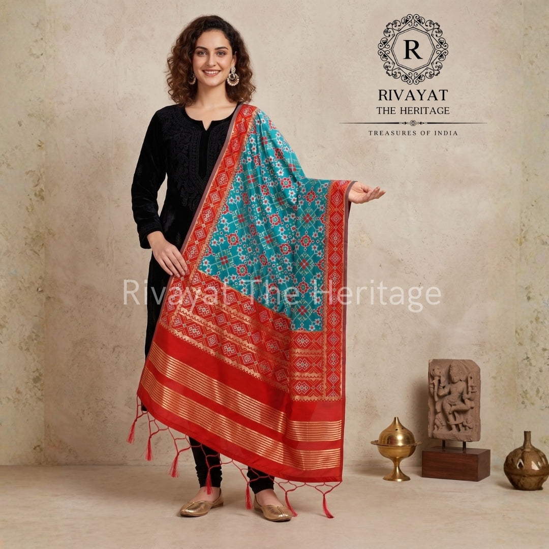 Red and turquoise traditional Patola silk dupatta from Rivayat Heritage.