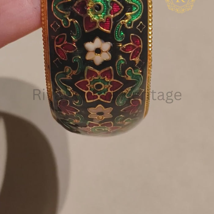 Black Meenakari kada with colourful floral motifs, enamel detailing and gold-tone finish