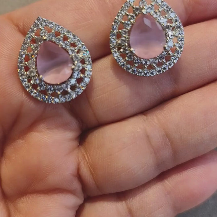 Pink stone zircon diamond earrings showing sparkling clear zircon stones and silver-tone teardrop design