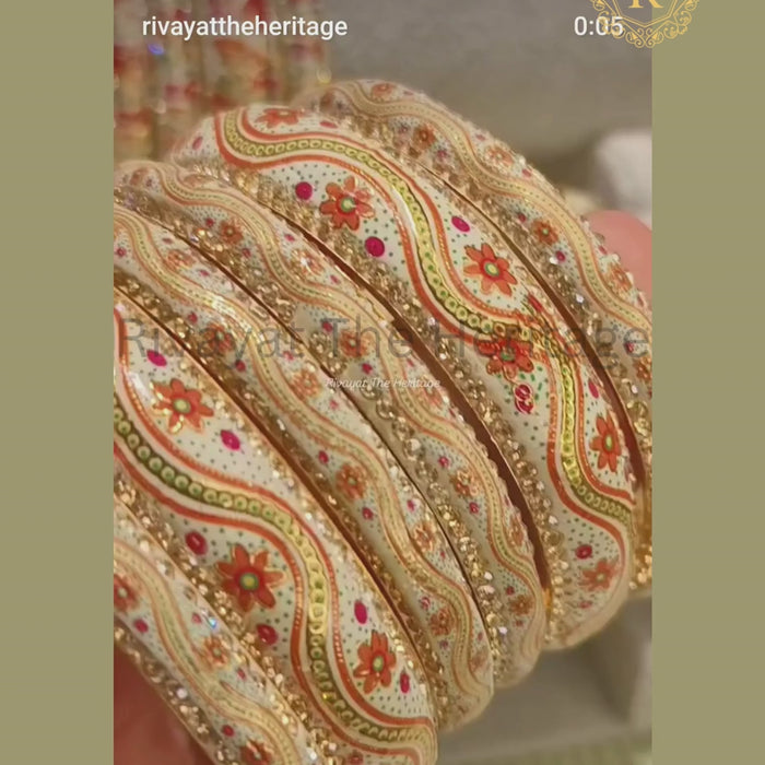 Video showcasing handcrafted Meenakari bangles with floral enamel work and kundan detailing