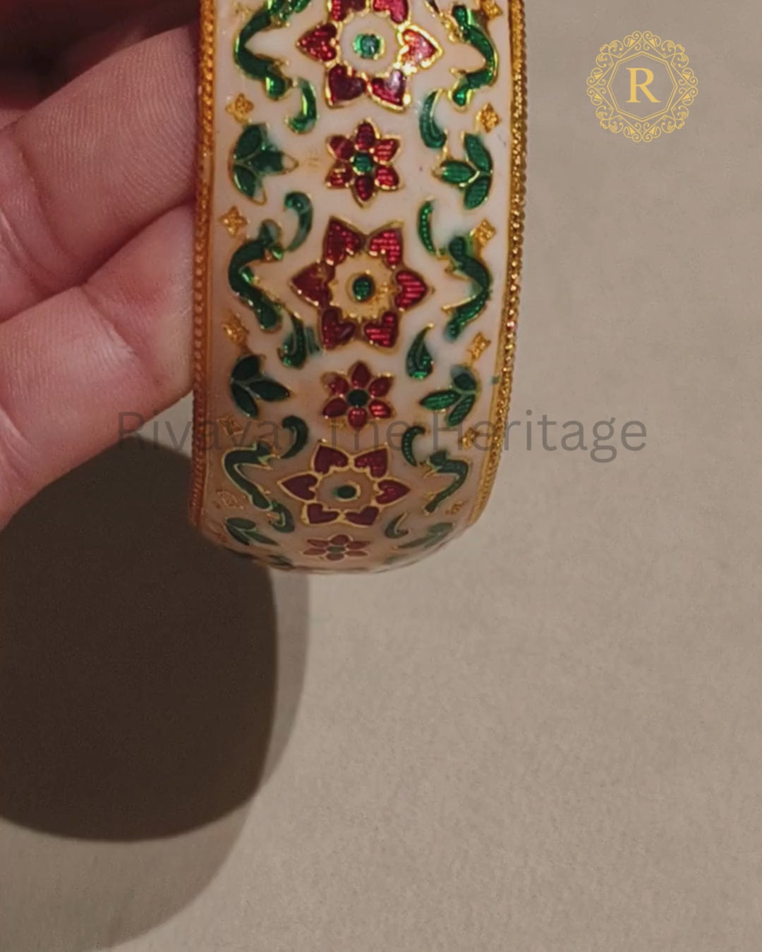 Ivory Meenakari Kada showcasing traditional red and green floral enamel work