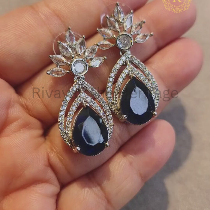 Video showcasing royal blue zircon diamond pear drop earrings sparkle and movement