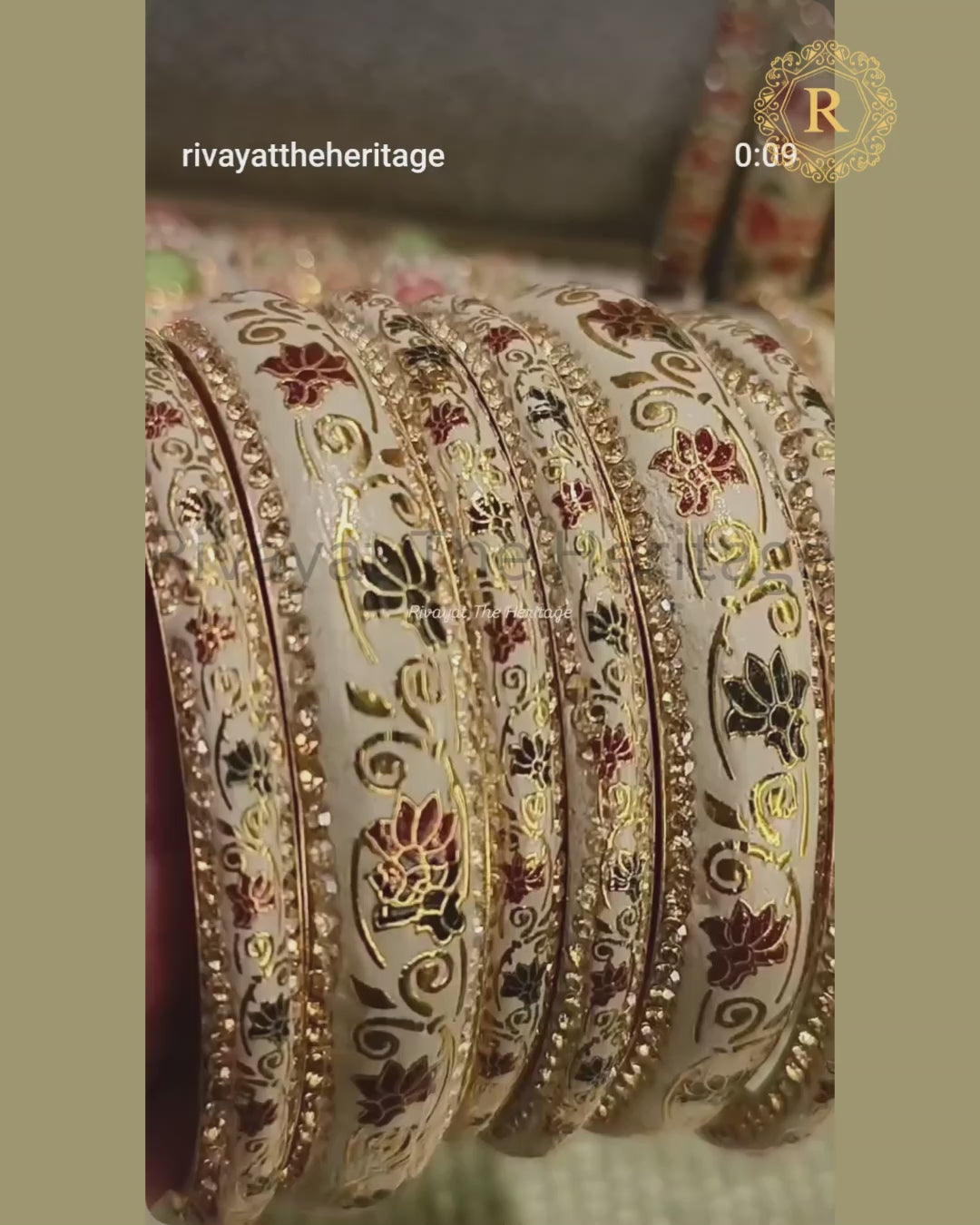 Ivory meenakari lotus bangles displayed in motion showing enamel detailing and stone sparkle