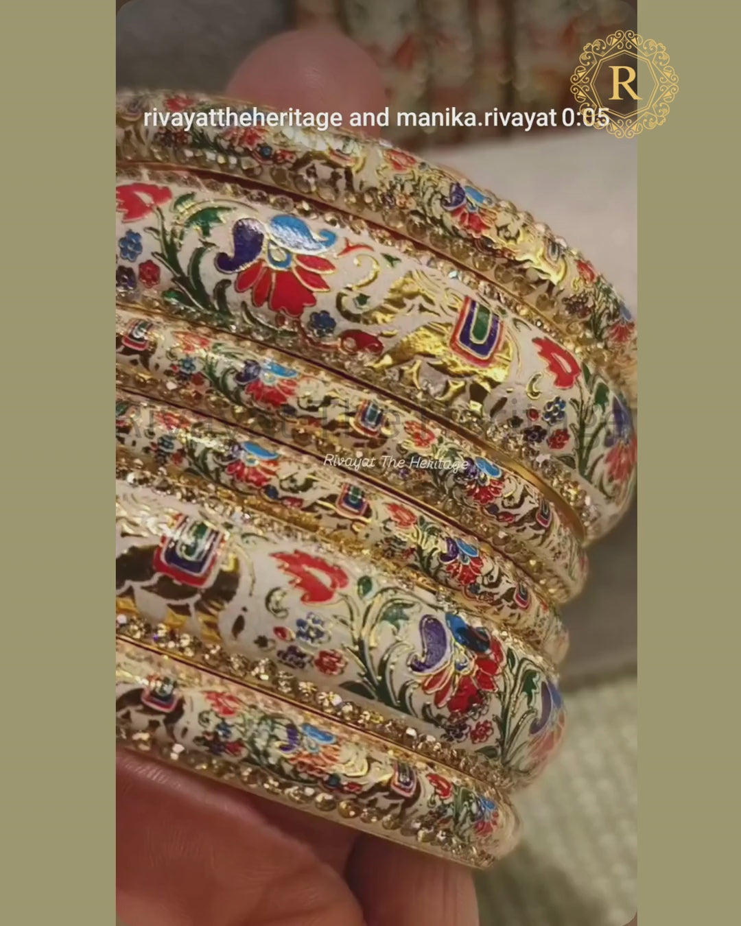 Video showcasing handcrafted ivory Meenakari bangles with peacock floral enamel work and stone-studded borders from Rivayat The Heritage